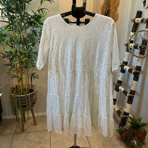 White sequined Darling Short Sleeve Dress.